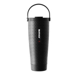 A black stainless steel travel tumbler with a golf-like pattern, featuring a green carrying handle and the brand name 'NAYAD' printed vertically on the front.