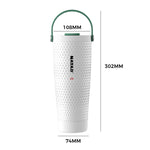A white stainless steel travel tumbler with a golf-like pattern, featuring a green carrying handle and the brand name 'NAYAD' printed vertically on the front., shown with dimension labels indicating 108mm top width, 302mm height, and 74mm base width.