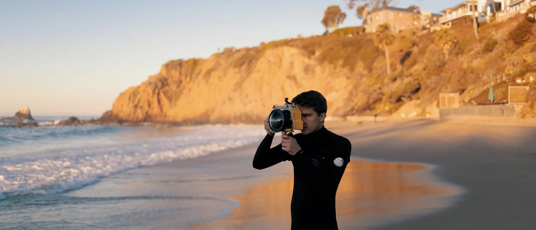 Dude named Parker holding ocean photo camera