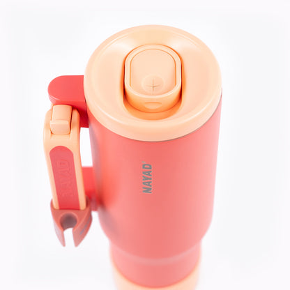 Orange colored thermos with a lipstick holder clip on a white background