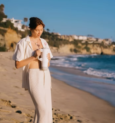 woman holding nayad stainless steel bottle
