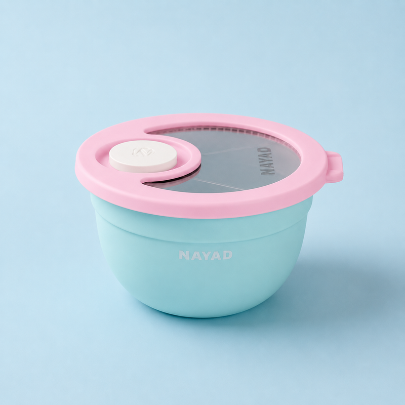 Light blue food container with pink lid on a light blue background