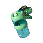 A children's water bottle with a green dinosaur-themed lid and straw. The bottle is translucent teal, featuring a mint green lid with a white straw, a green silicone collar, and a side-mounted green dinosaur figure with a blue and orange mouthpiece.