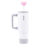 White coffee press with pink heart-shaped lid on a white background